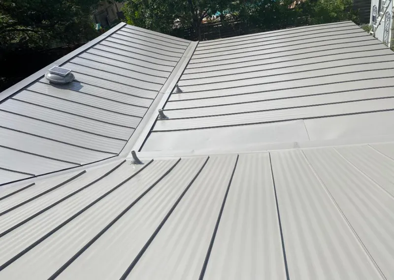 Solar attic fan installed on a metal roof for Roof Ventilation in Magalia